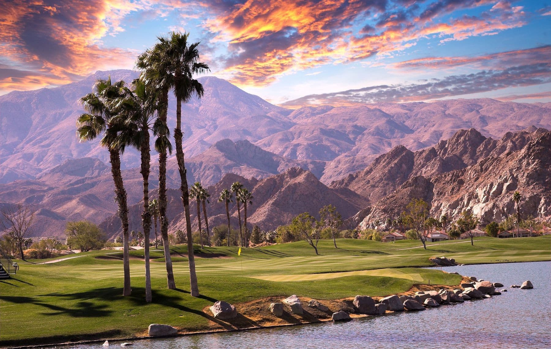 Palm trees and desert mountains in Southern California at sunset