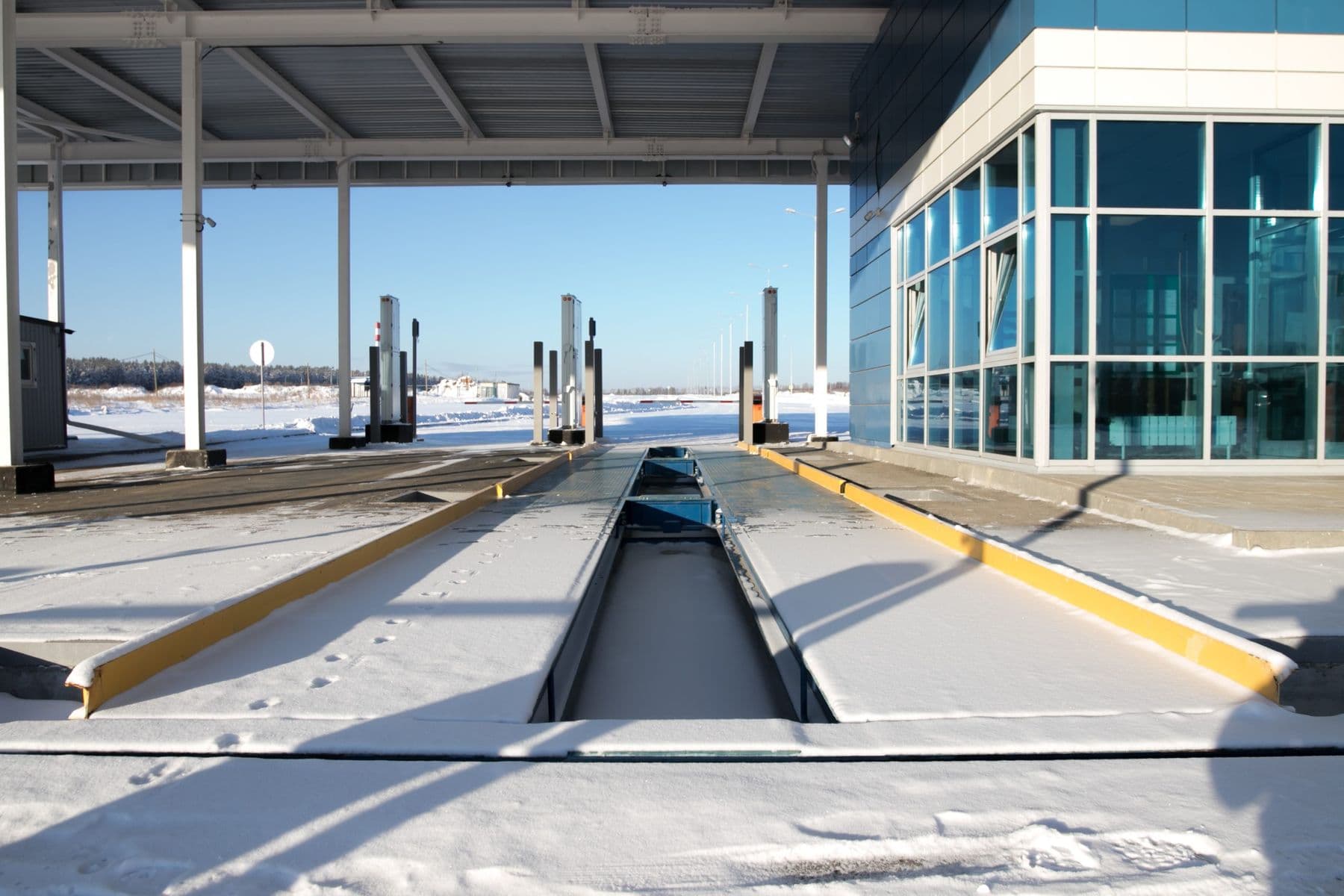 Covered vehicle weighing lanes