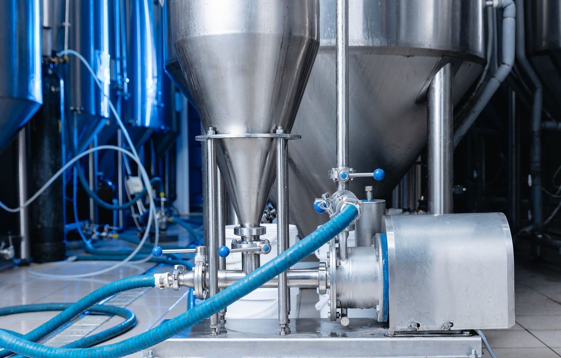 Stainless steel process tanks, pump, and hoses