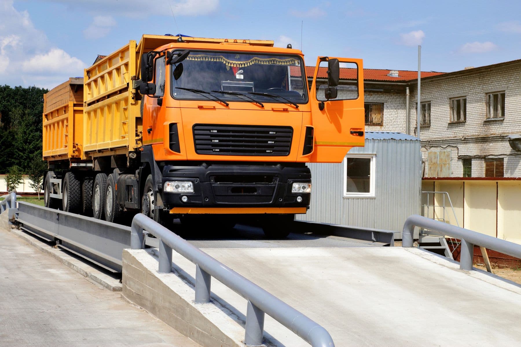 Dump truck driving onto a truck scale
