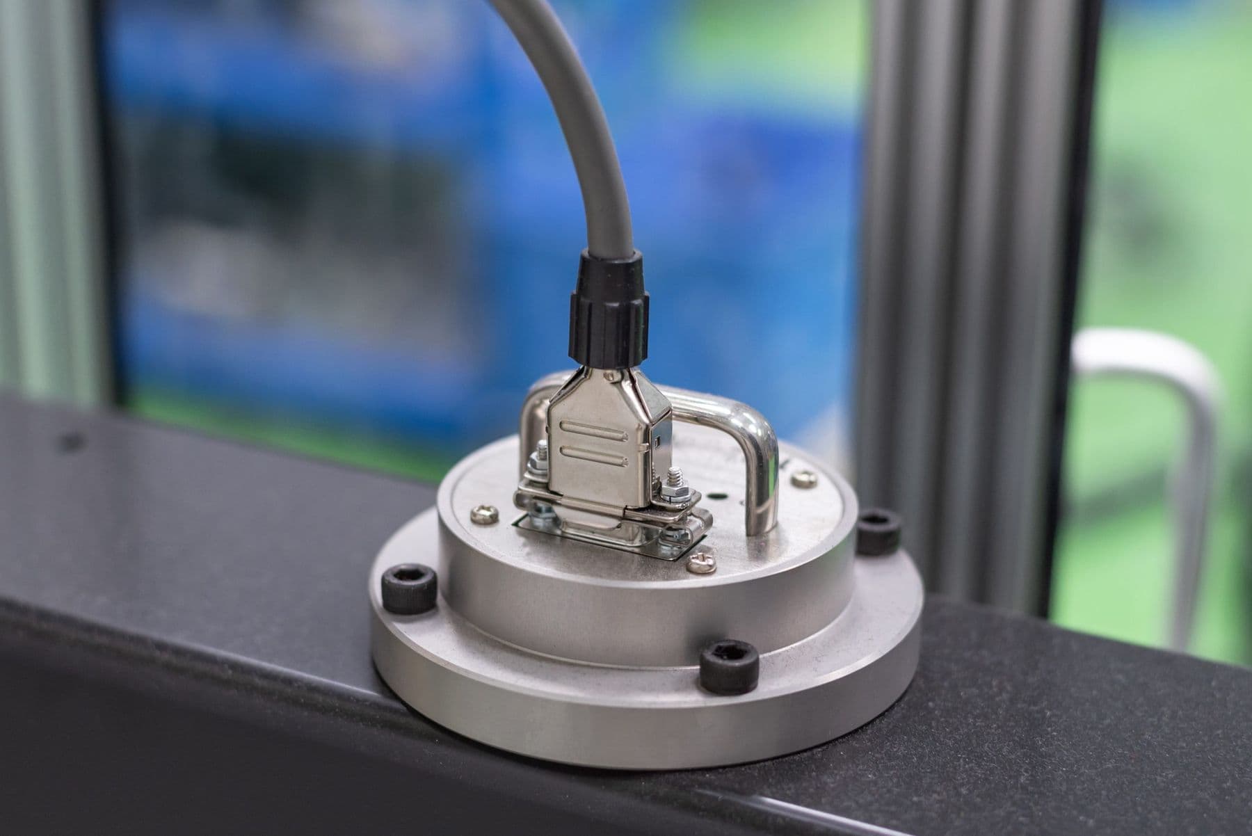 Round compression load cell with electrical connector