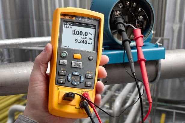 Handheld temperature calibrator connected to a transmitter