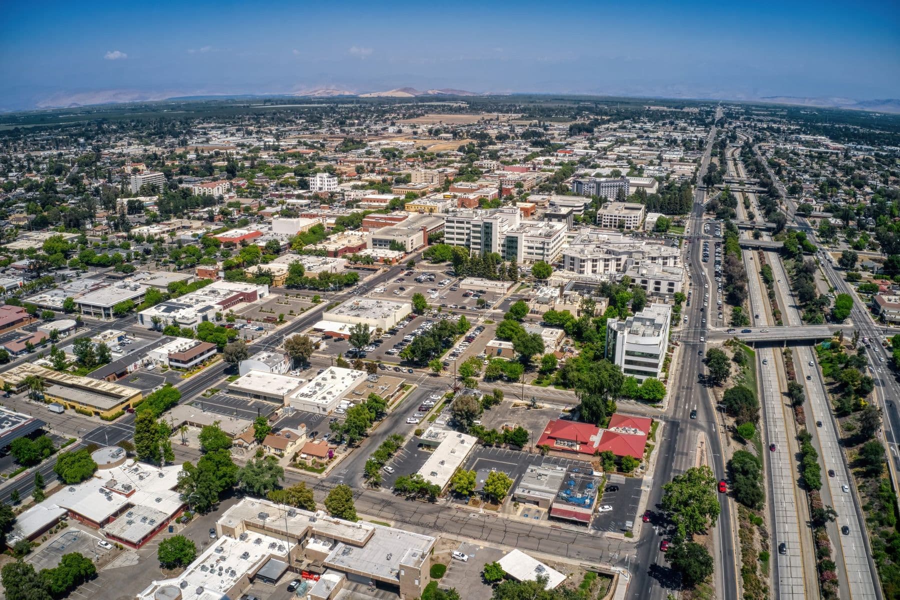 Aerial view of Visalia with the Sierra foothills in the distance