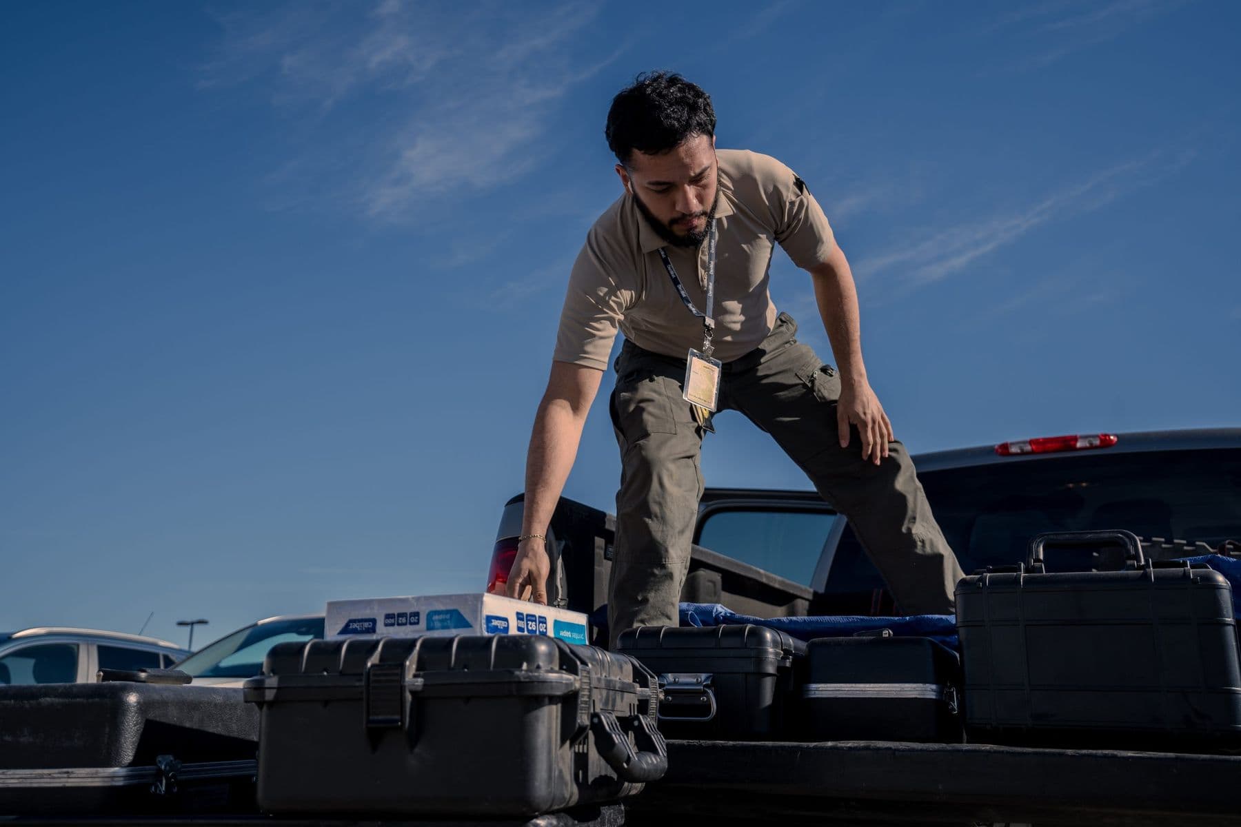 MS Weights & Scales technician arranging calibration equipment in a service truck